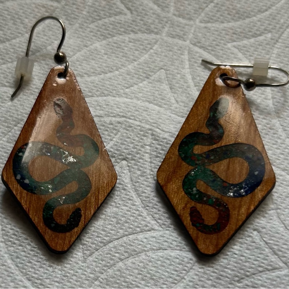 Bula Stone brand crushed stone and wood snake earrings.